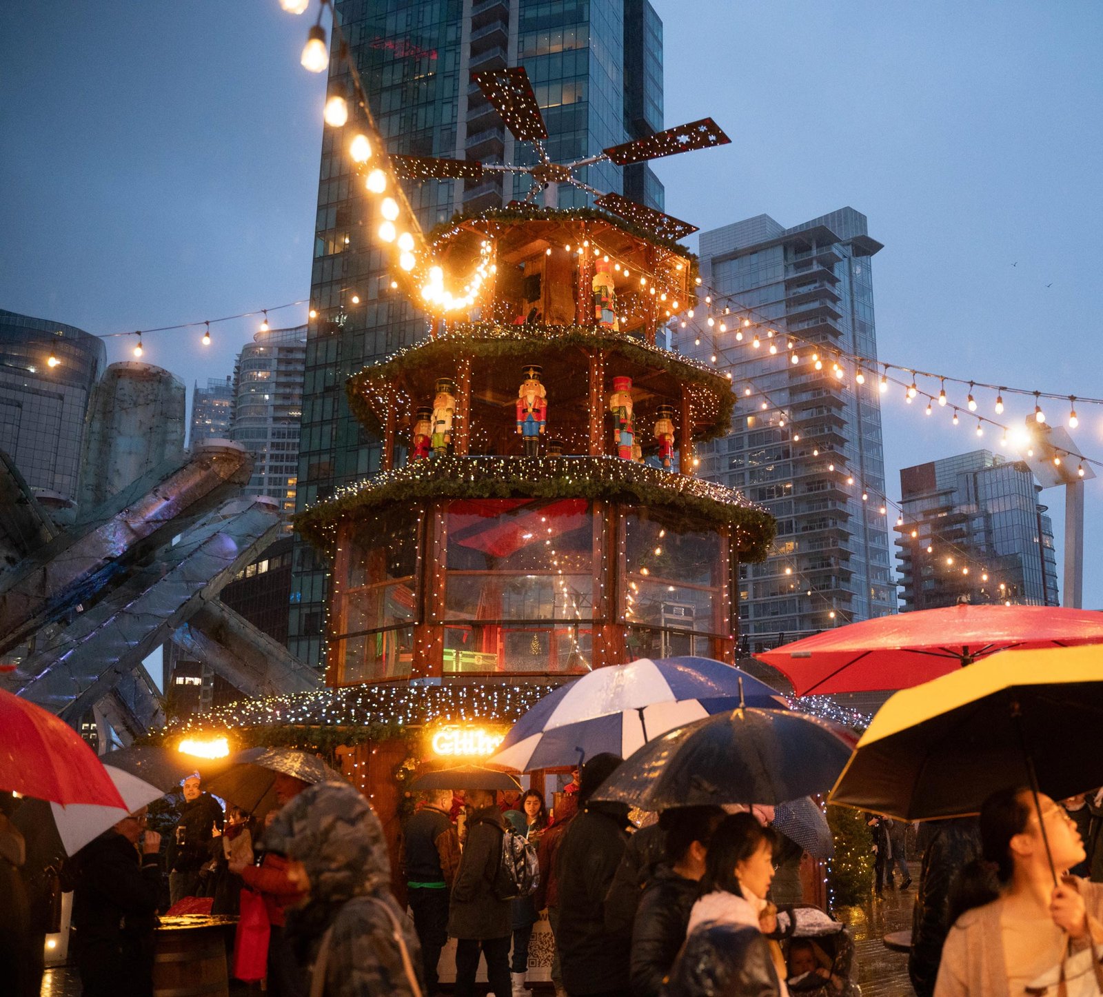 View of the Vancouver Christmas Market windmill surrounded by people